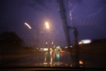 Lightning in sky while driving in downtown Rochester