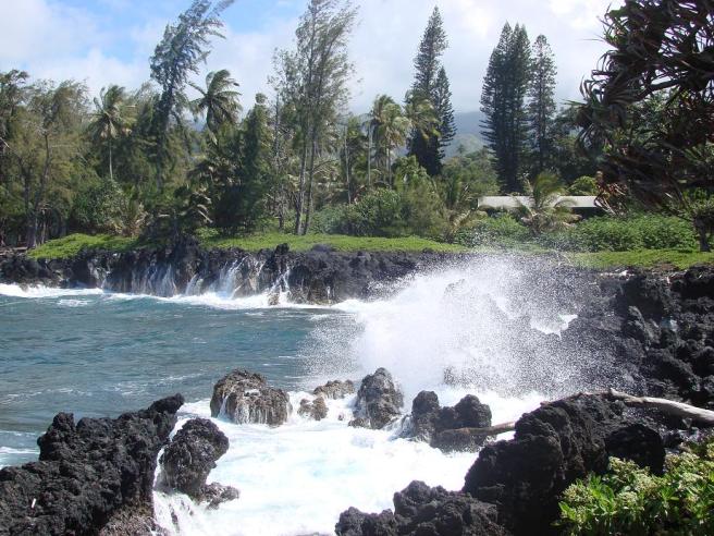 Waves breaking on Lava Rocks